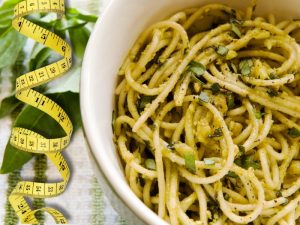 Healthy gluten-free pesto pasta dish, ideal for a weight loss or maintenance diet plan.